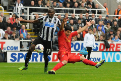 Luis Suárez of Liverpool tangles with Mapou Yanga-Mbiwa of Newcastle United  - Newcastle United vs Liverpool - Barclays Premier League Football at St James Park, Newcastle upon Tyne - 19/10/13 - MANDATORY CREDIT: Steven White/TGSPHOTO - Self billing applies where appropriate - 0845 094 6026 - contact@tgsphoto.co.uk - NO UNPAID USE Luis Suárez of Liverpool tangles with Mapou Yanga-Mbiwa of Newcastle United  - Newcastle United vs Liverpool - Barclays Premier League Football at St James Park, Newcastle upon Tyne - 19/10/13 - MANDATORY CREDIT: Steven White/TGSPHOTO - Self billing applies where appropriate - 0845 094 6026 - contact@tgsphoto.co.uk - NO UNPAID USE